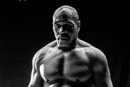 Mike Tyson poses for a picture.